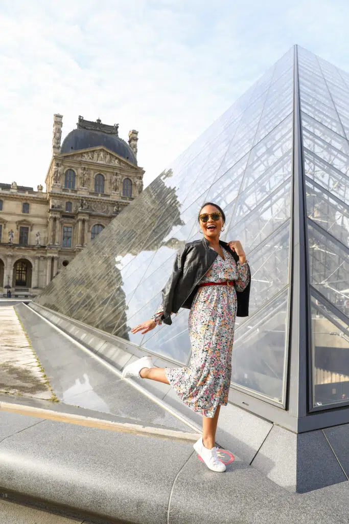 Photo of blogger Scotch and the Fox in front of The Louvre Pyramid in Paris, France